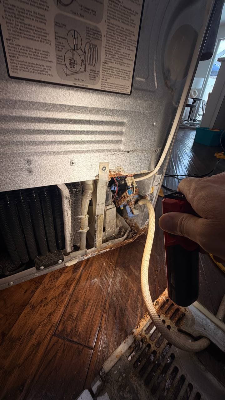 LG refrigerator water valve area corrosion from long-term leak in Naples