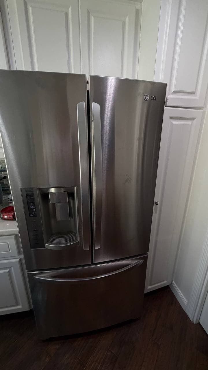 LG refrigerator cabinet inspection after water valve leak in Naples FL